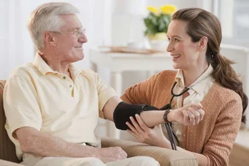 Nurse taking man's blood pressure