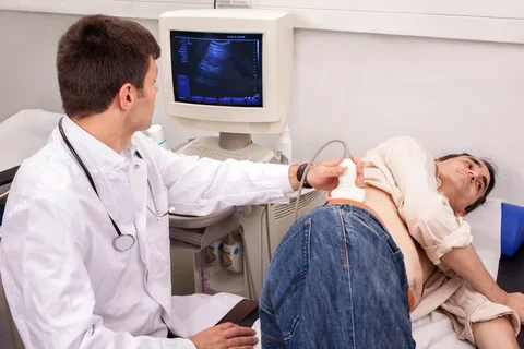Doctor checks man's kidneys