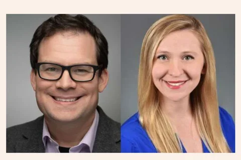 Man with glasses smiling and woman smiling