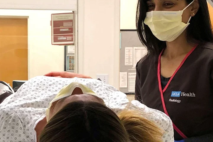 woman in Radiology deparmtnet checks patient