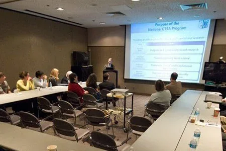 Auditorium with audience and screen