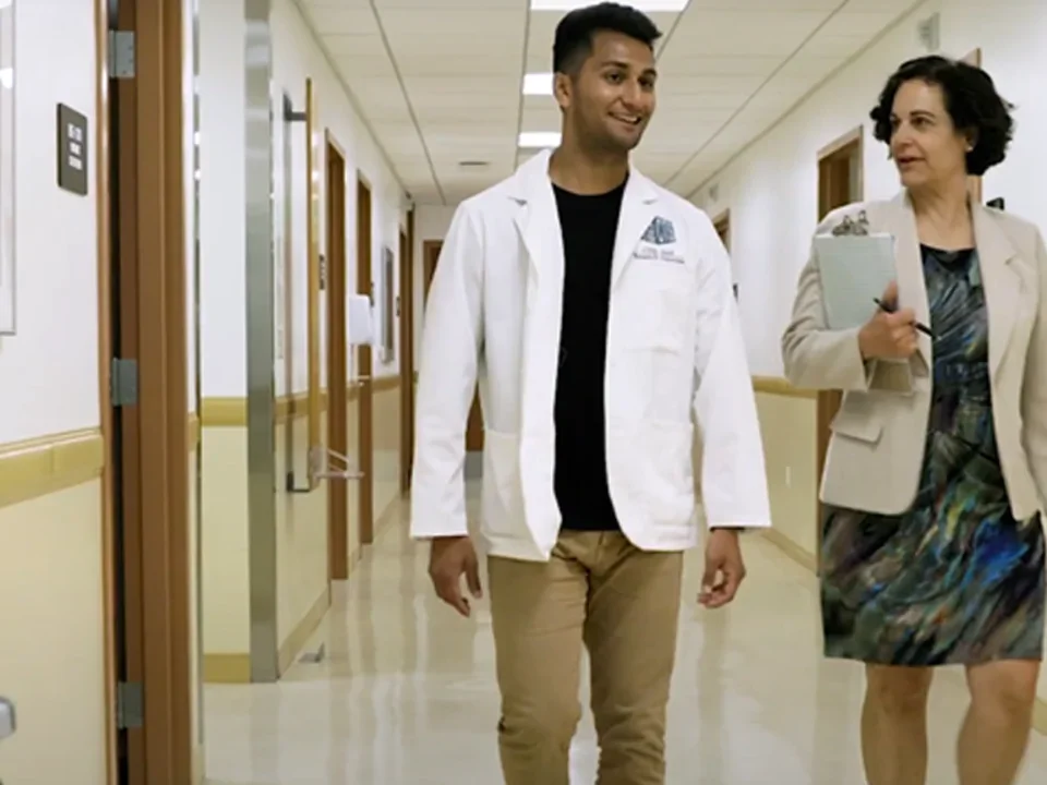 Scientists walking down hallway