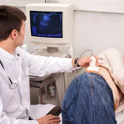 Doctor checks man's kidneys