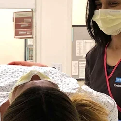 woman in Radiology deparmtnet checks patient