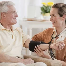 Nurse taking man's blood pressure
