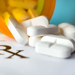 Image of pills spilling out of pill bottle