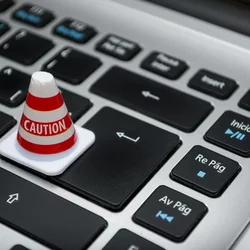 Caution Cone on a Laptop